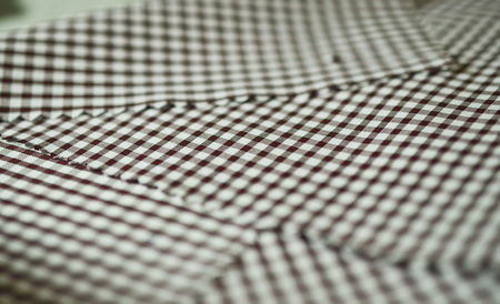 close up texture brown scott pattern fabric of shirt, photo shoot by depth of field for objectの写真素材