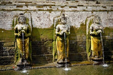 Fountain sculpture at Goa Gajah Elephant Cape in Bali Indonesiaの写真素材