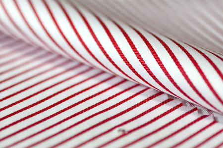 close up texture fabric thin red line and white of shirt, photo shoot by depth of field for objectの写真素材