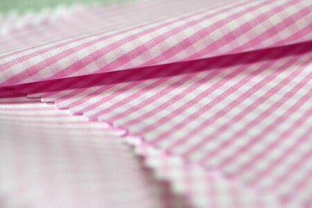 close up stripe texture pink fabric of shirt, photo shoot by depth of field for object