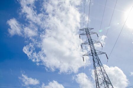High voltage pole with the blue sky backgroundの写真素材