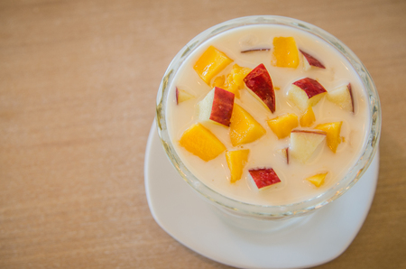 Yogurt fruit salad with apple and mango, healthy foodの写真素材