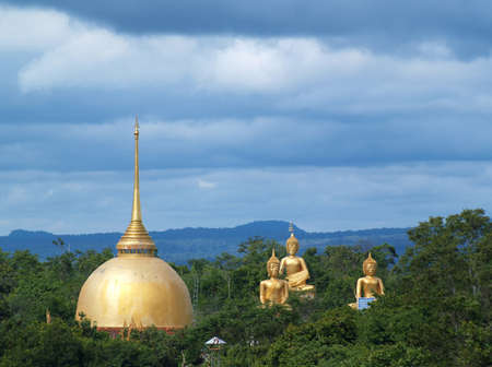 Golden stupa and Buddha in forestの写真素材