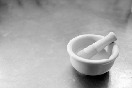 A white porcelain mortar on white backgroundの写真素材
