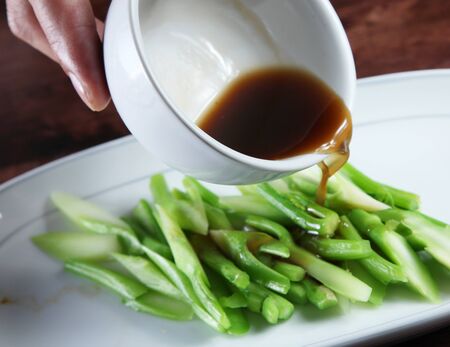 Kale pouring with oyster sauce の写真素材