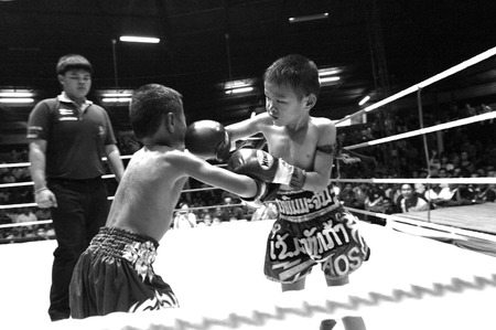 UBON RATCHATHANI, THAILAND â JUNE 14, 2003 : Thai young boxers fighting on boxing ring on June 14, 2003 in Wing21 Air Force Army, Ubon Ratchathani, Thailand.のeditorial素材