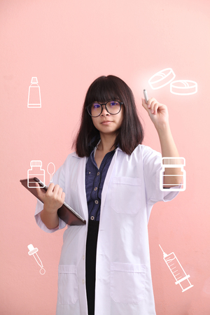 Young Asian Scientist point with penの写真素材