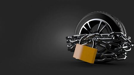 Car tire with chains and padlock on gray backgroundの写真素材