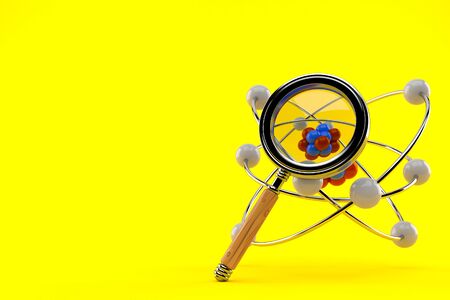 Atom model with magnifying glass isolated on orange backgroundの写真素材