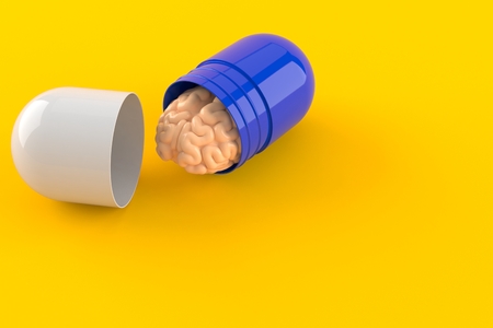 Brain with pill isolated on orange backgroundの写真素材