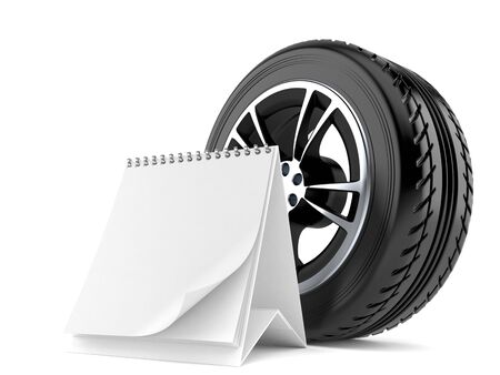 Car wheel with blank calendar isolated on white backgroundの写真素材