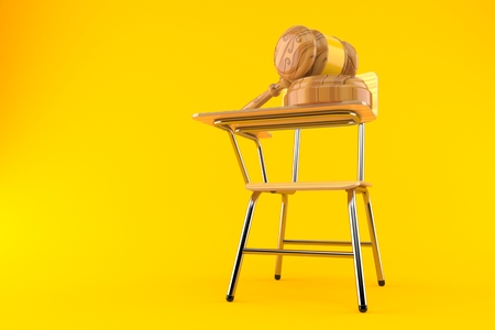 Gavel with school chair isolated on orange backgroundの写真素材