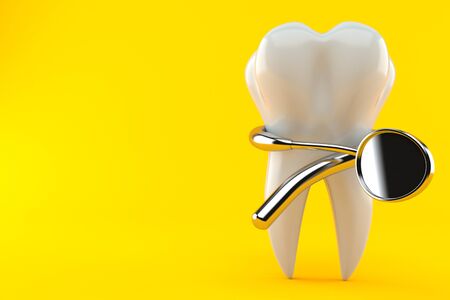 Tooth with dental tool isolated on orange backgroundの写真素材