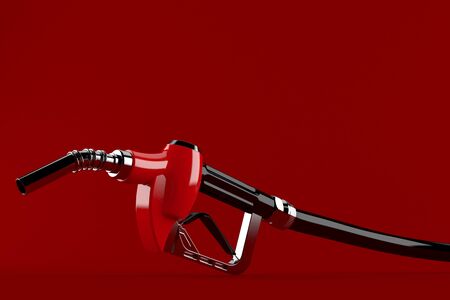 Gasoline nozzle isolated on red backgroundの写真素材