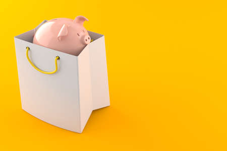 Piggy bank inside shopping bag isolated on orange backgroundの写真素材
