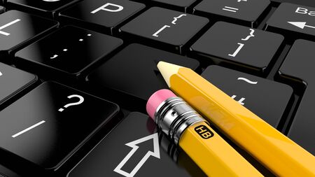 Computer keyboard with pencilsの写真素材