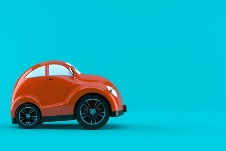 Red car side view isolated on blue backgroundの写真素材