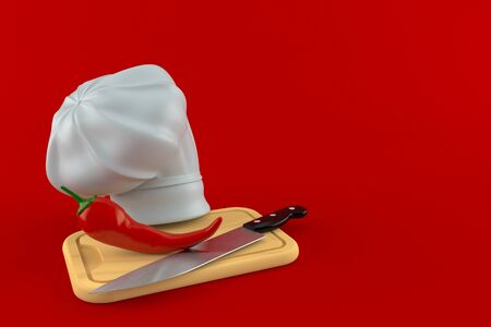 Hot paprika with chef's hat isolated on red backgroundの写真素材