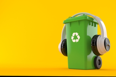 Dustbin with headphones isolated on orange background. 3d illustrationの写真素材