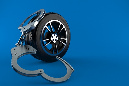 Car tire with handcuffs isolated on blue background. 3d illustrationの写真素材