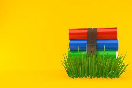 Books on grass isolated on orange background. 3d illustrationの写真素材