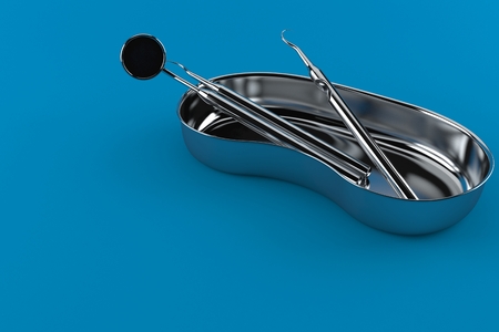 Dental tools isolated on blue background. 3d illustrationの写真素材