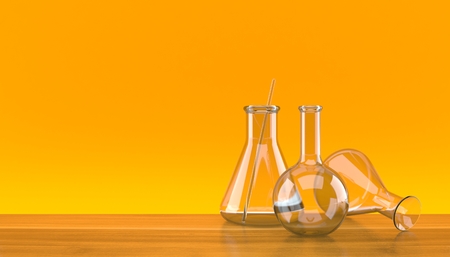 Chemistry flasks on orange background. 3d illustrationの写真素材