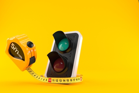 Green traffic light with measuring tape isolated on orange background. 3d illustration