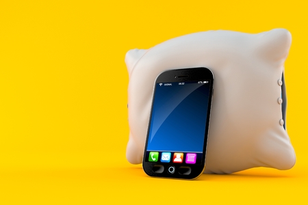 Pillow with smart phone isolated on orange background. 3d illustrationの写真素材