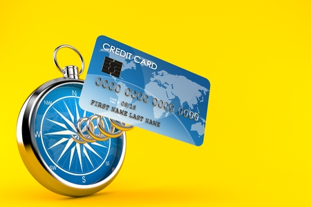 Credit card with compass isolated on orange background. 3d illustrationの写真素材