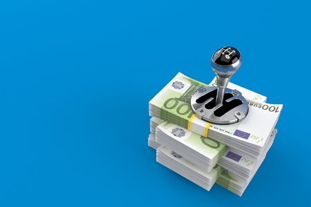 Gearshift on stack of money isolated on blue background. 3d illustrationの写真素材