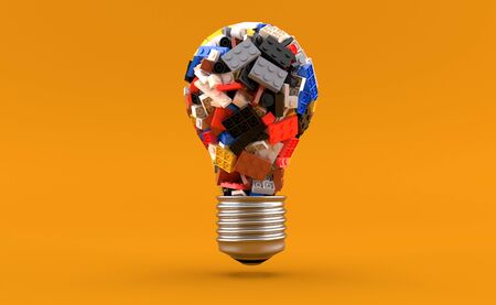 Bricks in light bulb shape isolated on yellow background. 3d illustrationの写真素材