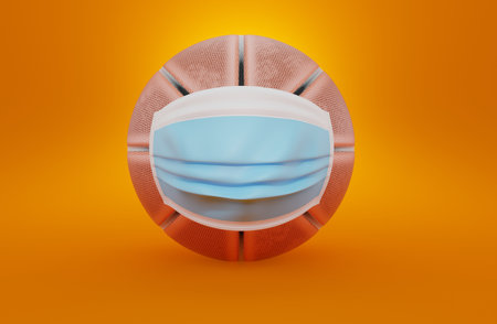 Basketball ball with medical mask on orange background. 3d illustrationの写真素材