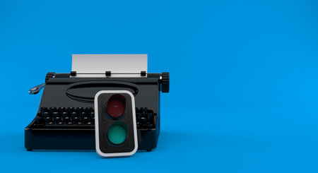 Typewriter with green traffic light isolated on blue background. 3d illustration