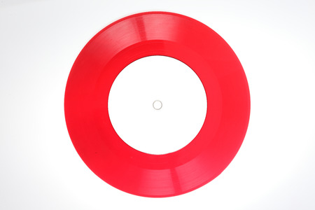Red vinyl records isolated on whiteの写真素材