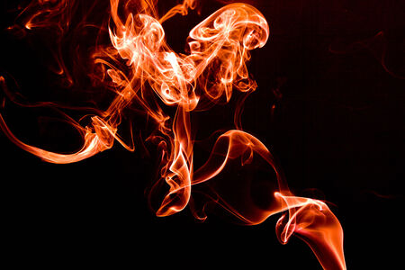 Red smoke on a black background の写真素材