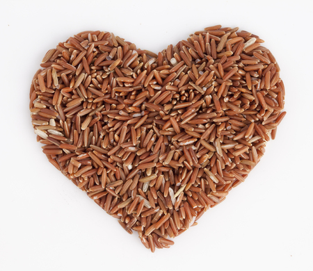 Brown rice with heart shapeの写真素材