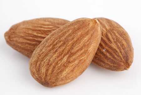 almonds isolated on the white backgroundの写真素材