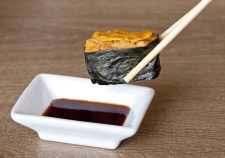 Uni, sea urchin egg over riceの写真素材