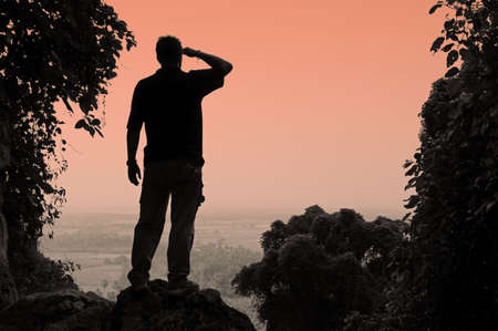 Man looking out over Thailand's central plainsの写真素材