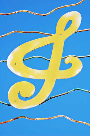 Treble clef metal cutout above a pubの写真素材