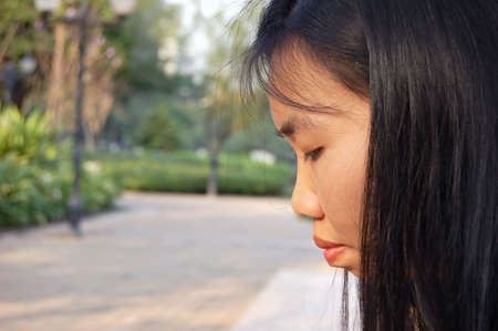 Side profile of a young Thai womanの写真素材