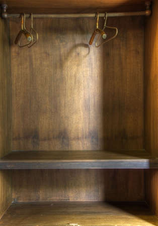 The inside of an empty wooden wardrobeの写真素材