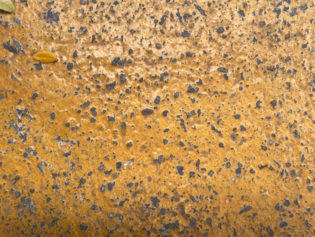 The cement floor has traces of old age and is an abstract pattern. There is an empty space in the...