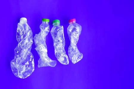 Twisted and plastic bottles, concept for making smaller size before recyclying to reduce the pollution and global warming.の写真素材