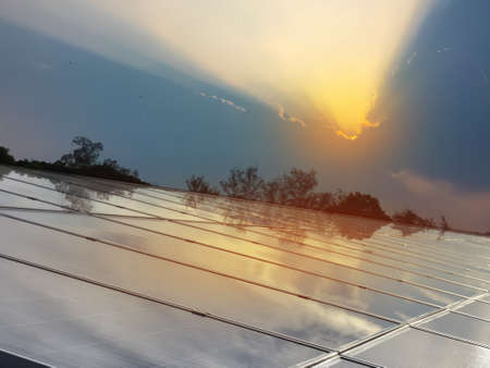 Photovoltaic panels installed on the toproof of the building, sustainable energy concept.