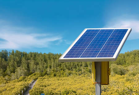 Mini solar cells panels with landscape, skyscape, sustainable energy from the sunlight and the...