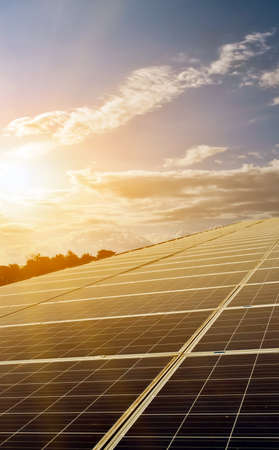 Photovoltaic roof with bluesky background, concept for using the natural energy from the sunlight at...