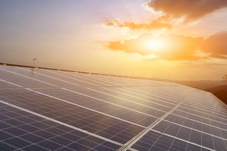 Photovoltaic panels installed on the toproof of the building, sunlight and cloudy bluesky...