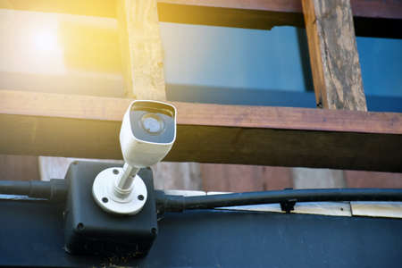 IP CCTV camera or security camera which house owner installed on the wall to monitor and to do the...